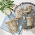 glass water with wicker rattan and handle